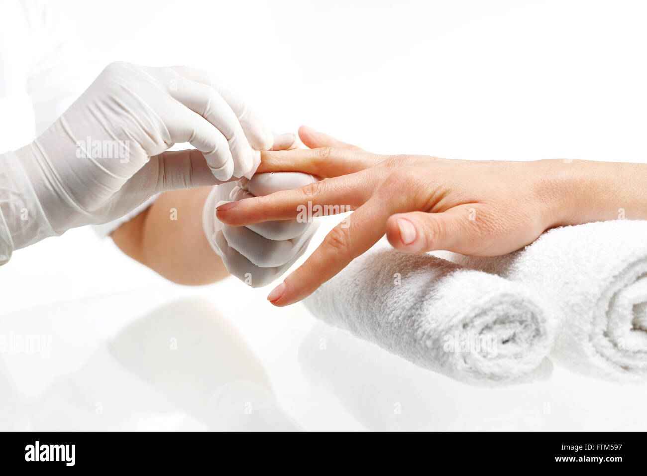 Removal of nail varnish. manicure. Beautician removes nail polish with