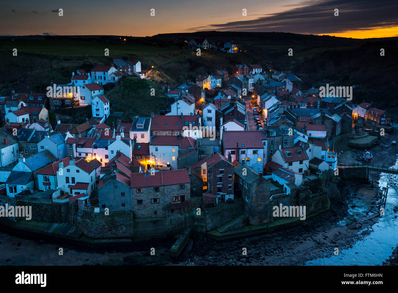 Lighting up Time at Staithes North Yorkshire from Cowbar Stock Photo