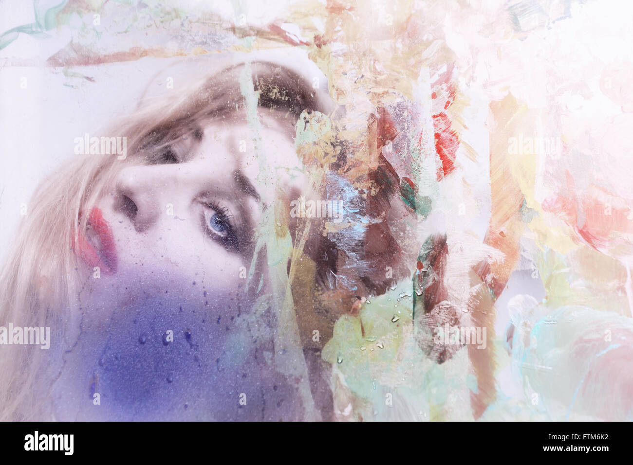 Portrait of a beautiful woman through the dirty glass closeup Stock ...