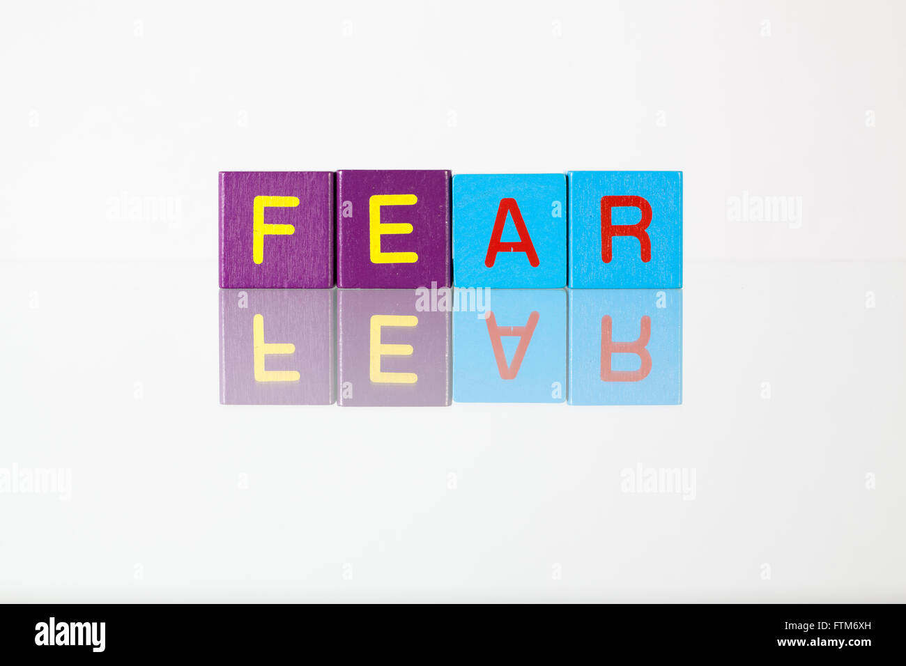 Fear - an inscription from children's wooden blocks Stock Photo