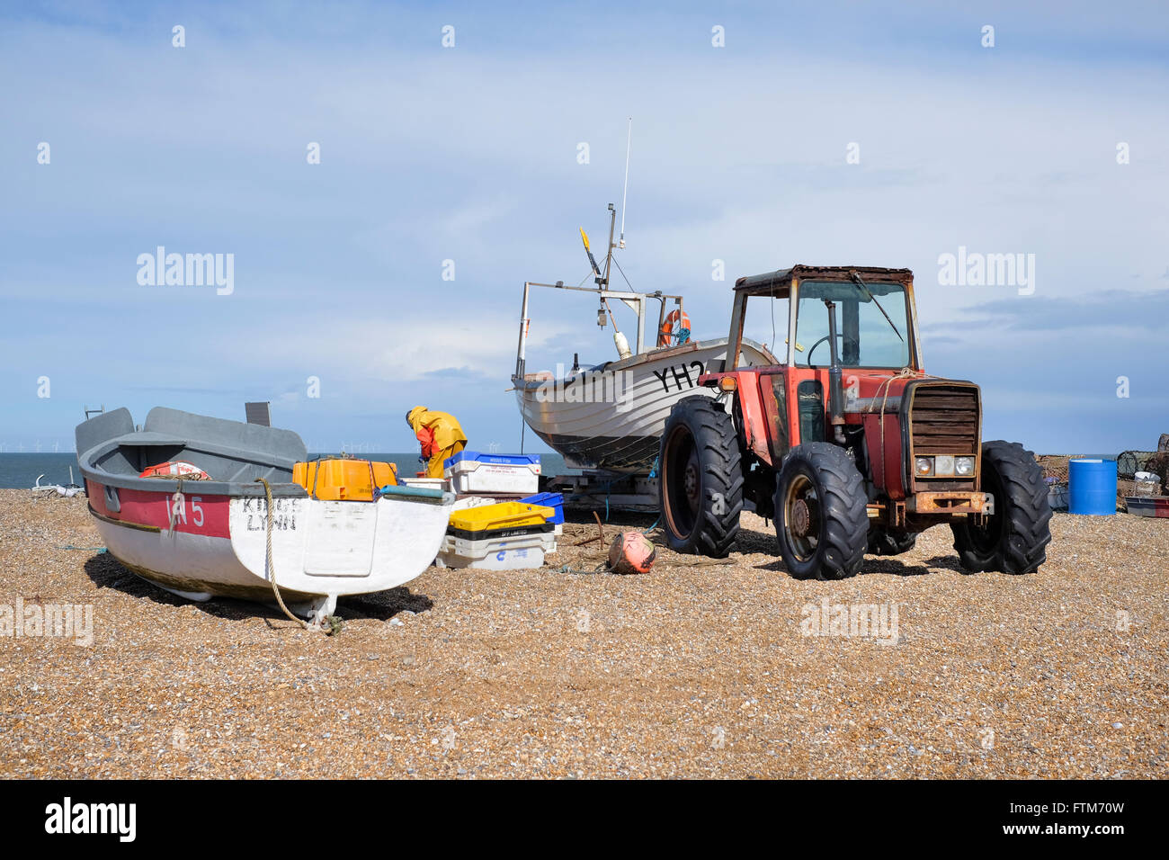 A crab/lobster fisherman prepares to go fishing on the beach at Cley Next The Sea, Norfolk, England, UK Stock Photo