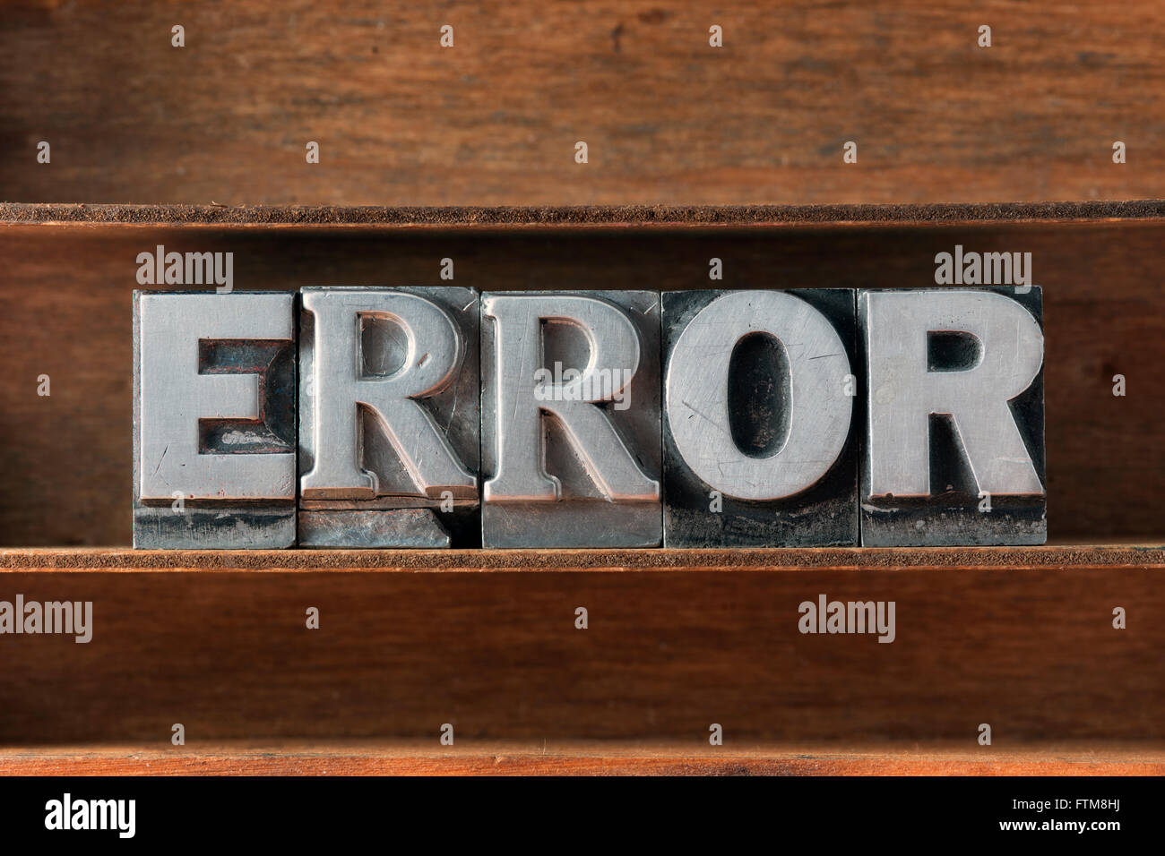 error word made from metallic letterpress type on wooden tray Stock Photo