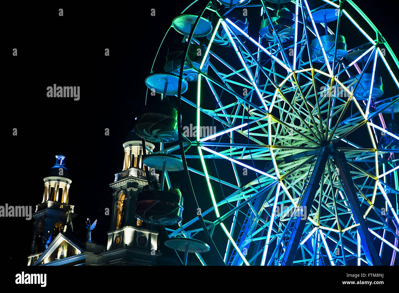 Night view of amusement park - Incidental Church of Our Lady of Nazare Stock Photo