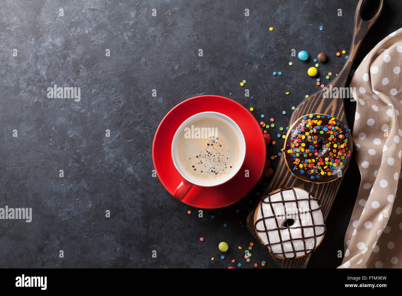 Donuts and coffee on stone table. Top view with copy space Stock Photo ...