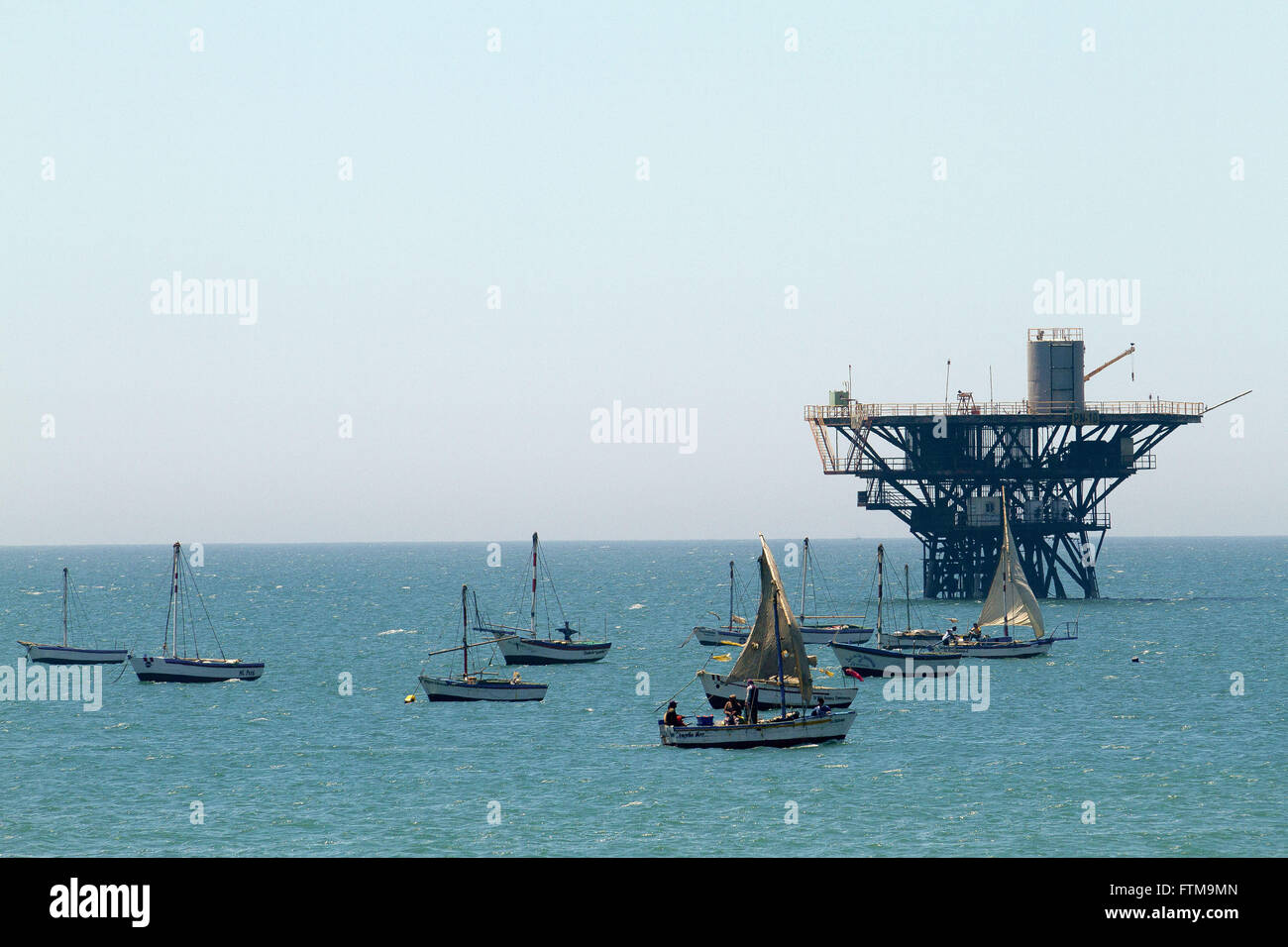 Vessels and oil rig in Cabo Blanco in the province of Talara Stock Photo