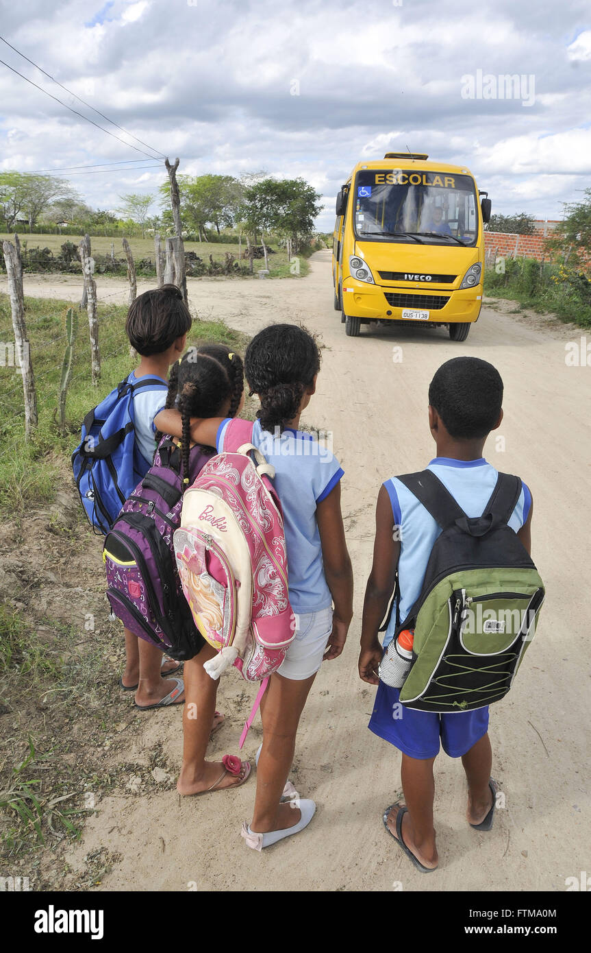 Children waiting for school buses in the village of Umbuzeirinho Stock Photo