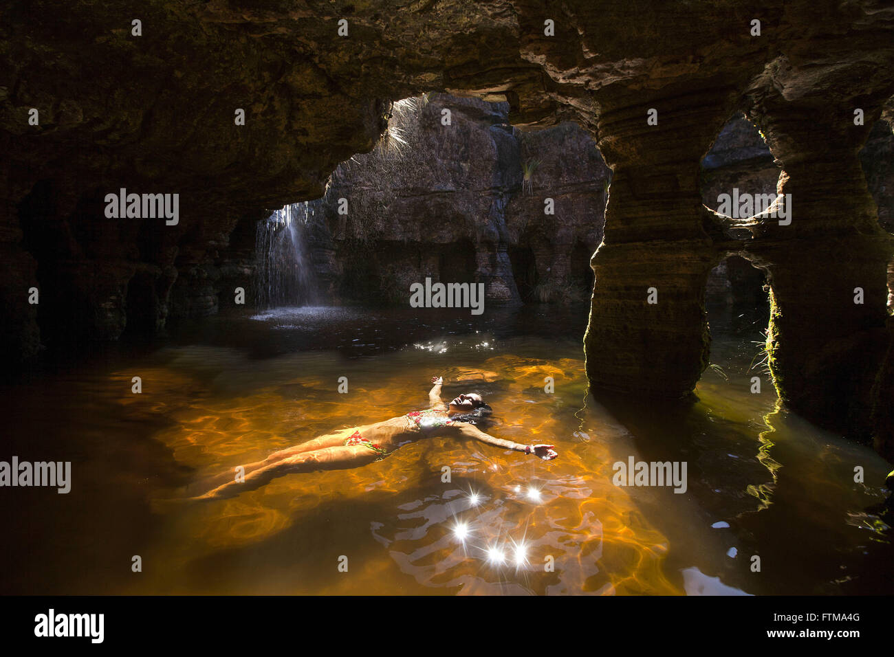 Tourist in cave lake in Fosso - Mount Roraima National Park Stock Photo
