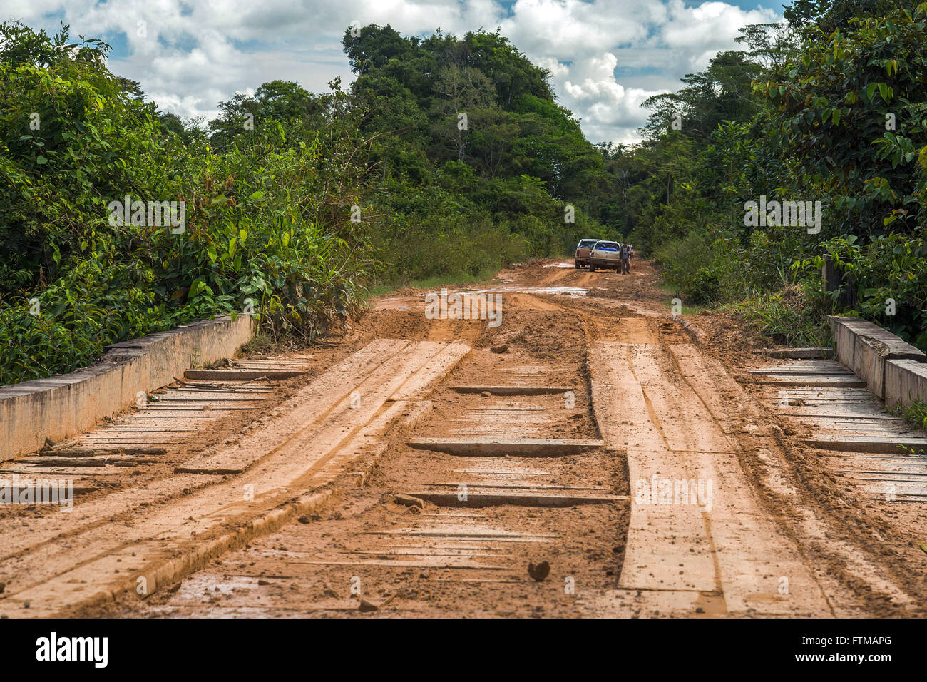 Wooden bridge and stretch of land the MT-208 highway Stock Photo