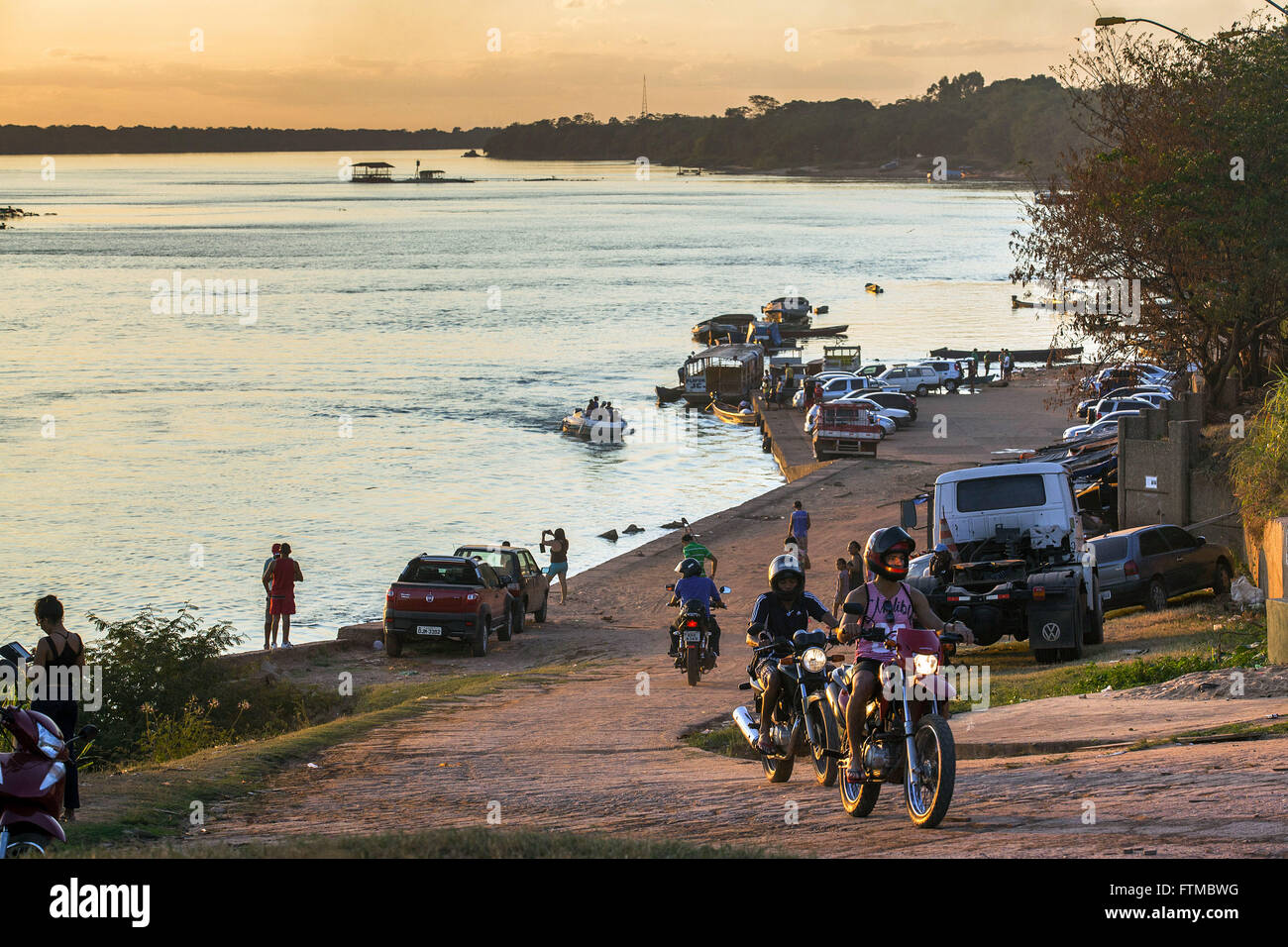 Vehicles on the bank of the Tocantins River Stock Photo