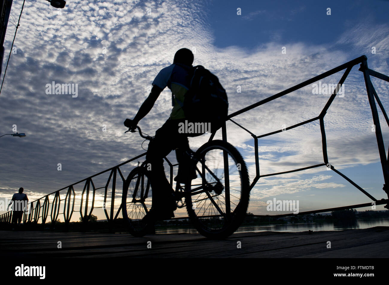 Cyclist and pedestrian crossing the bridge over the River Marechal Hermes San Francisco Stock Photo