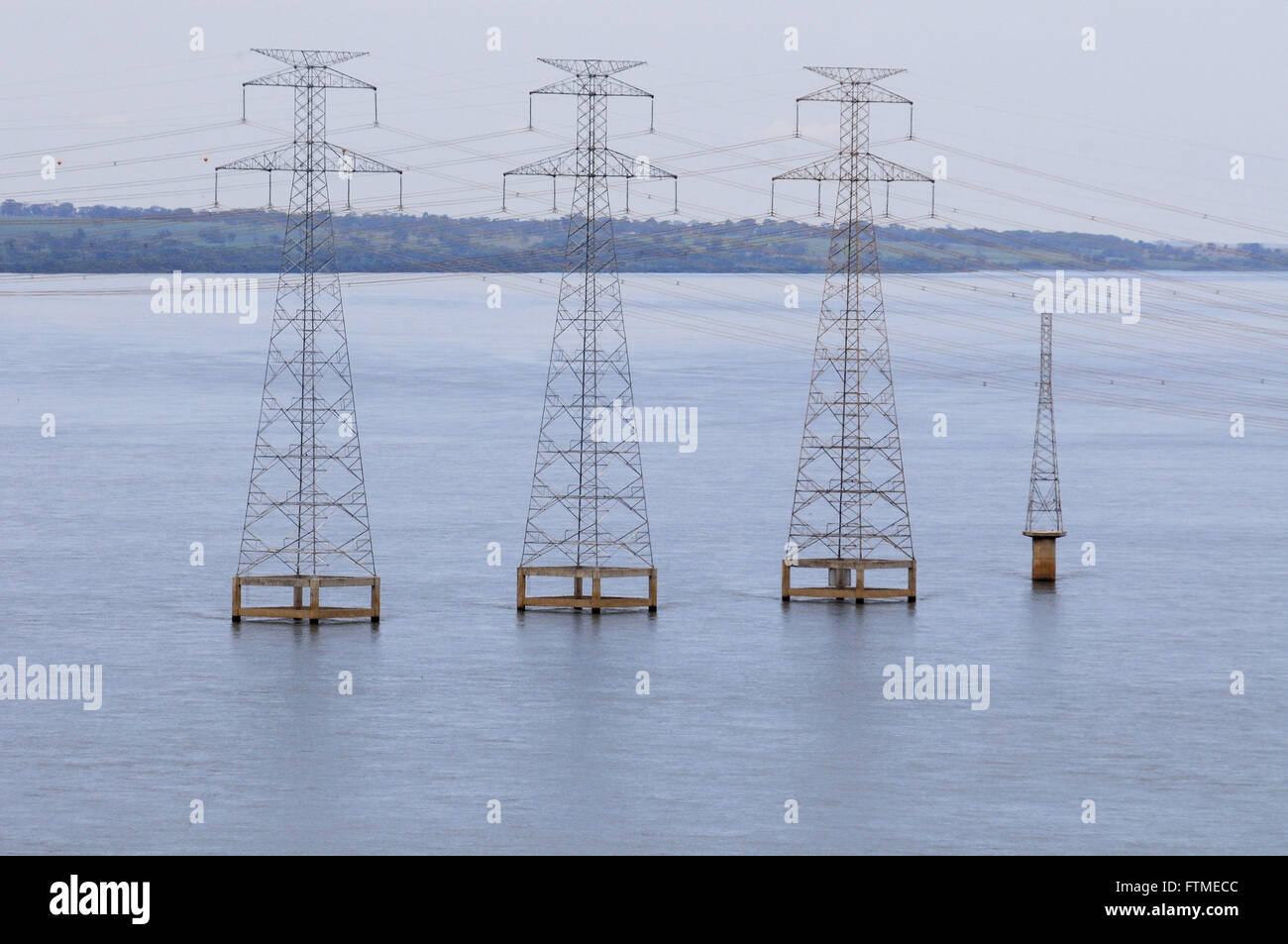 Power transmission towers in the Rio Parana Stock Photo