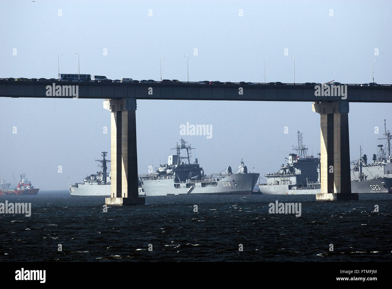 BR-101 Rio-Niteroi Bridge and warships moored at Naval Base Rio de Janeiro Stock Photo