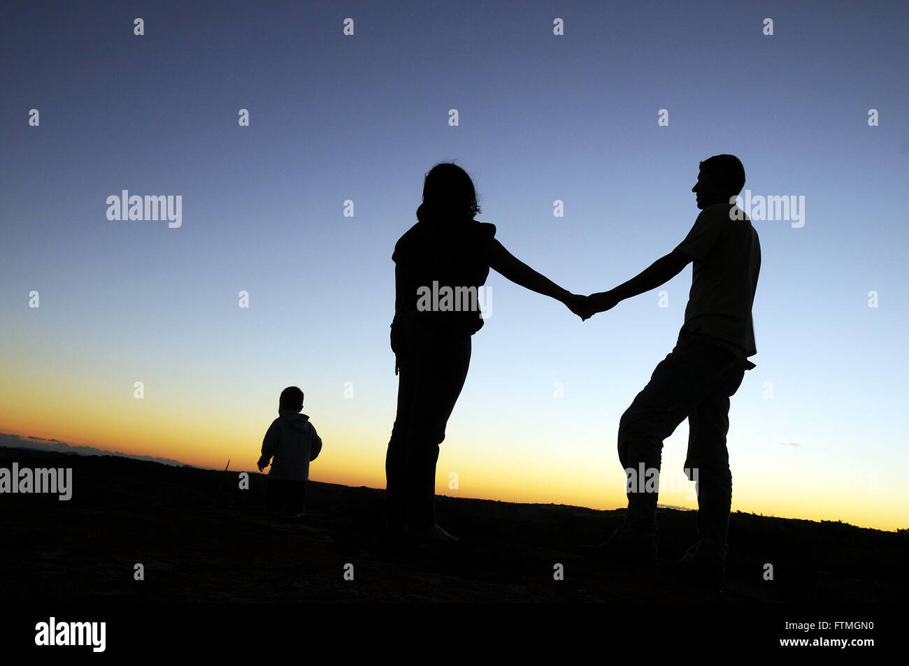 Women watching the sunset hi-res stock photography and images - Alamy