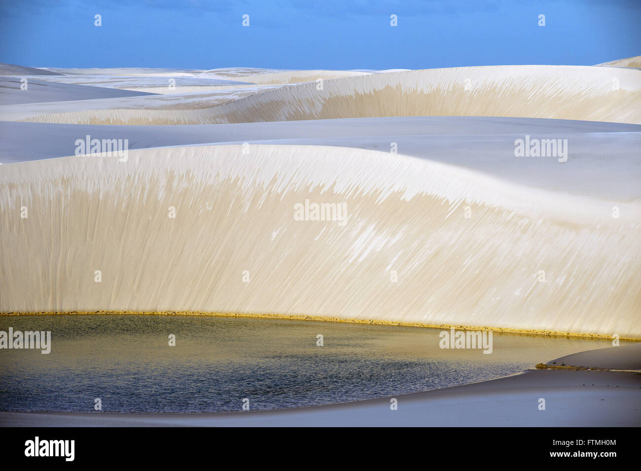 Pond through the dunes of the Lencois Maranhenses National Park Stock Photo