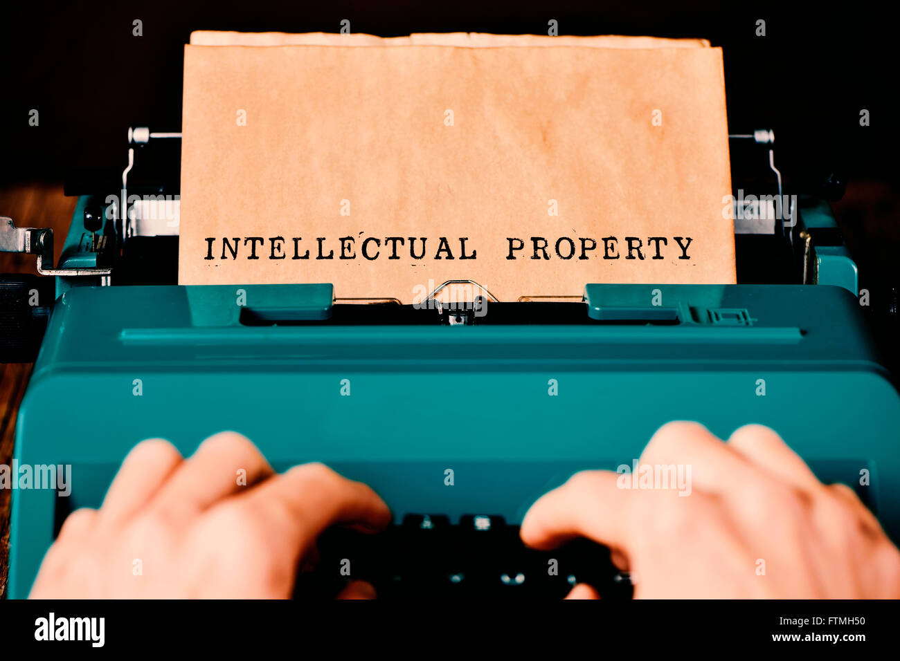 the text intellectual property written in a yellowish paper with a retro typewriter Stock Photo