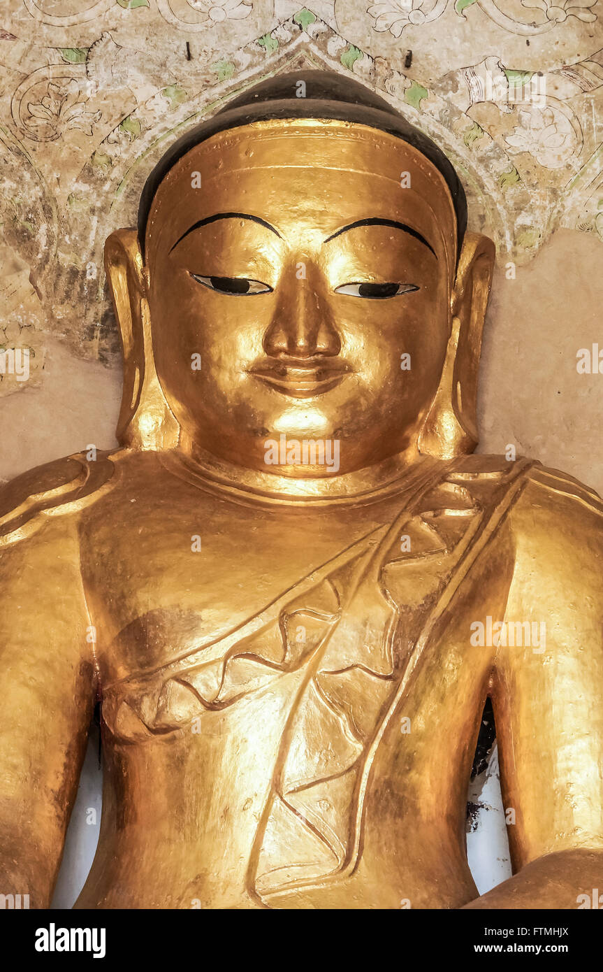 Round golden Buddha face in temple in Myanmar Stock Photo