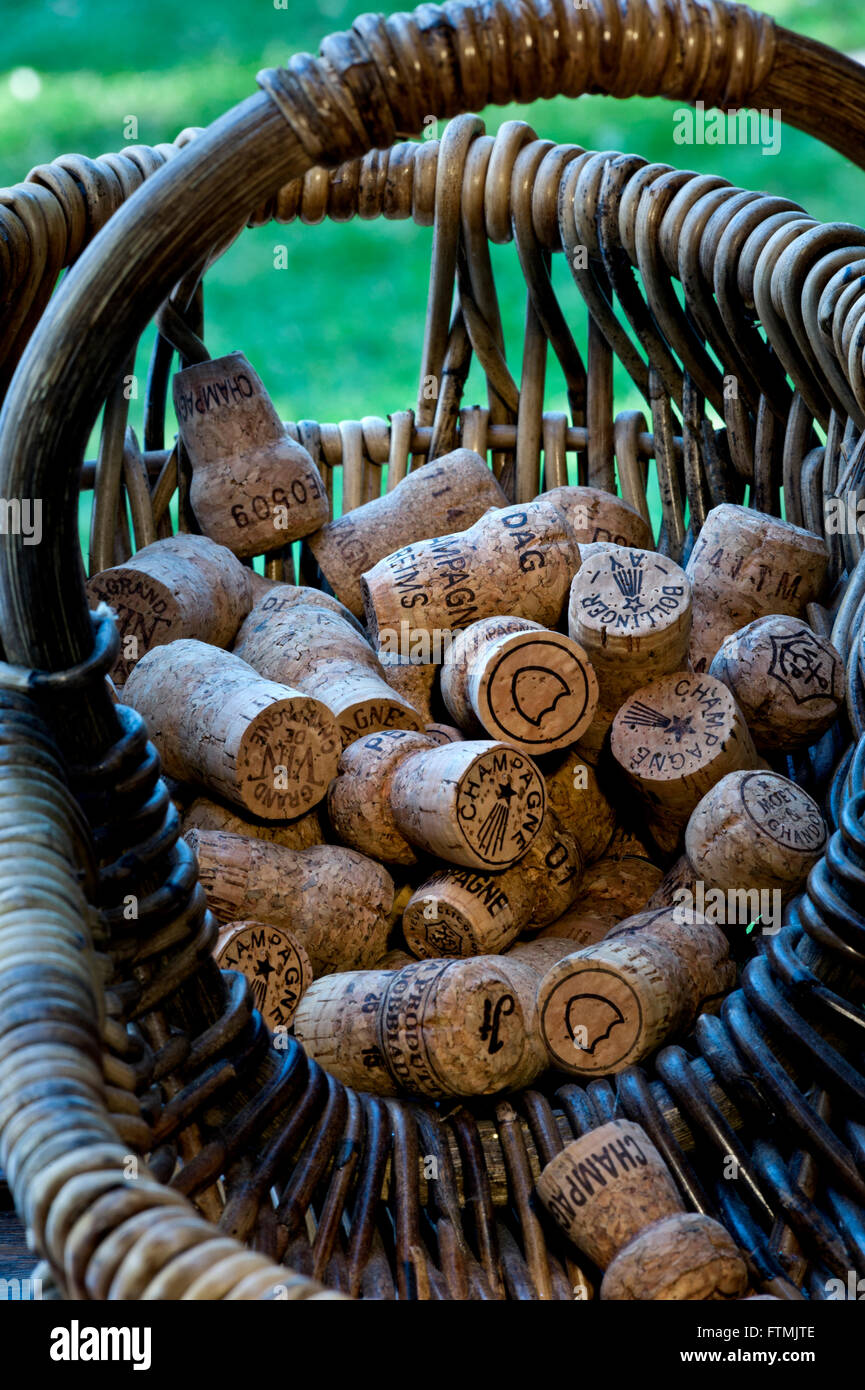 Concept image of French grape pickers harvest basket with selection of various luxury champagne corks Stock Photo