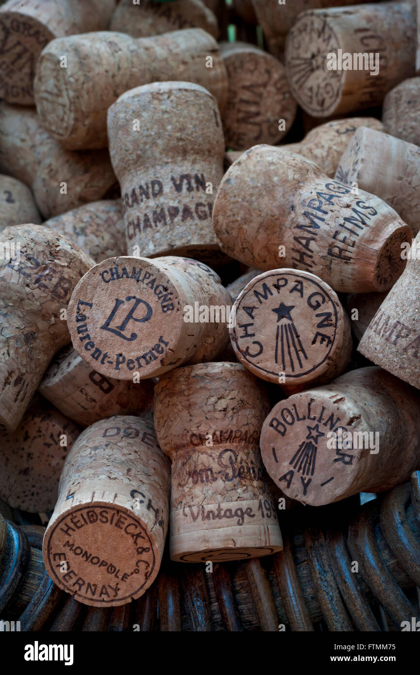 Atmospheric image of French grape pickers harvest basket with selection of various luxury champagne corks Stock Photo