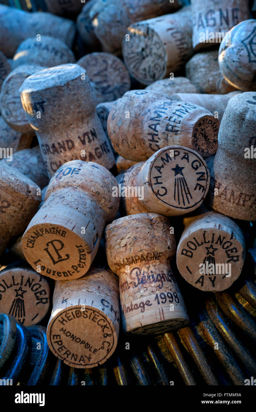 Atmospheric image of French grape pickers harvest basket at sunset with quality selection of various luxury champagne corks Stock Photo