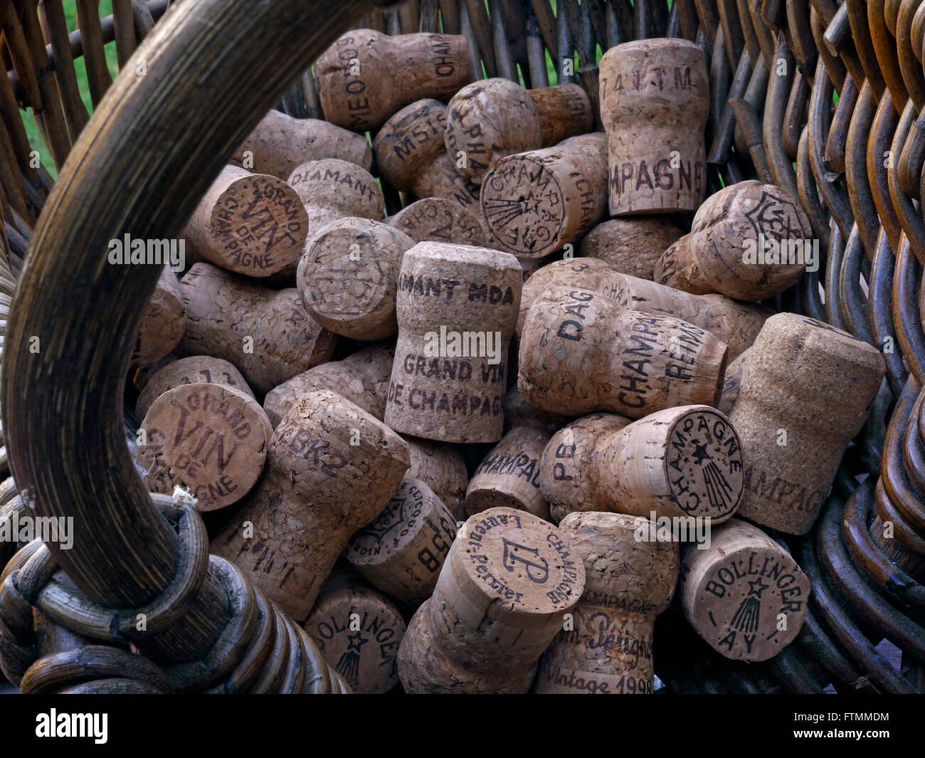 CHAMPAGNE CORKS HARVEST CONCEPT image of French grape pickers harvest basket with quality selection of various luxury champagne corks France Stock Photo