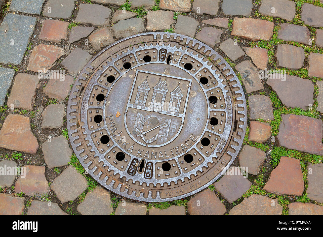 Decorative metal drain cover in Prague, Czech Republic Stock Photo