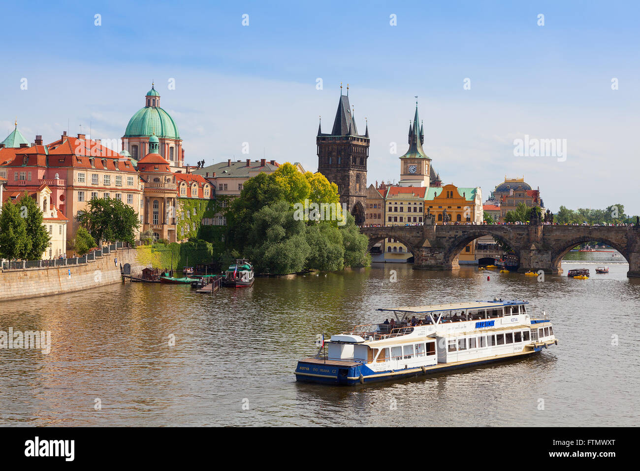 View of Charles Bridge in Prague showing the tower and St Francis church Stock Photo