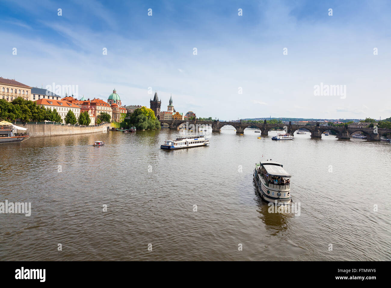 View of Charles Bridge in Prague showing the tower and St Francis church Stock Photo