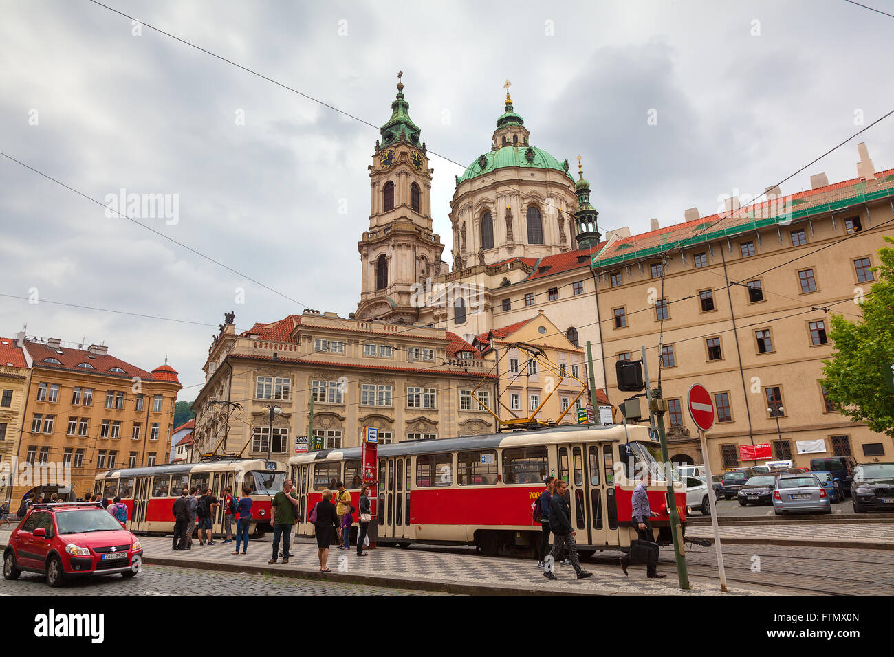 Lesser town square with tram station and St Nicholas Church, Prague, Czech Republic Stock Photo