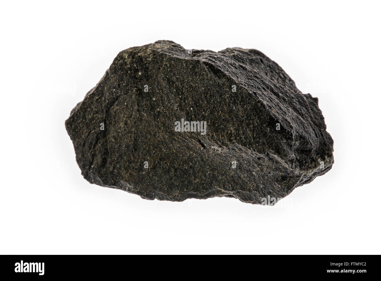 Basalt, extrusive igneous volcanic rock specimen on white background Stock Photo