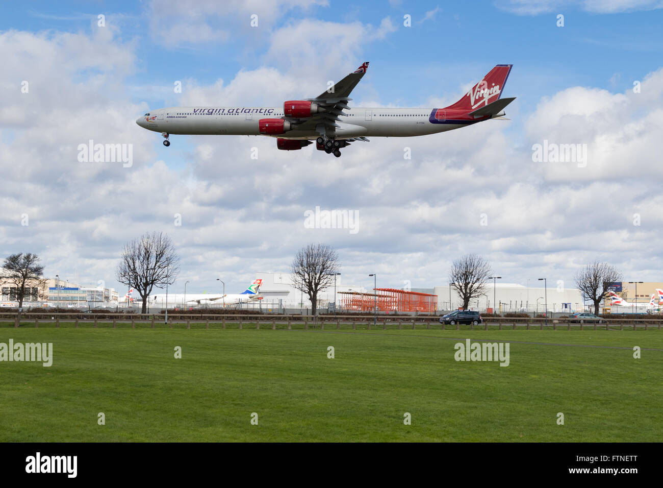 A Virgin Atlantic Airbus A340-600 reg. G-VYOU about to land on runway 27L at London Heathrow Stock Photo