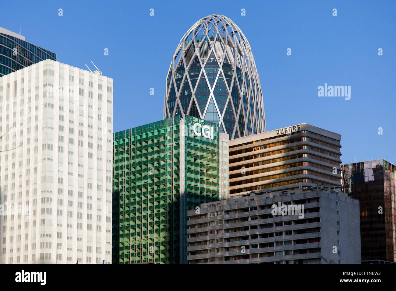 Caption of buildings in 'LA DEFENSE' area in PAris , with a blue sky background Stock Photo