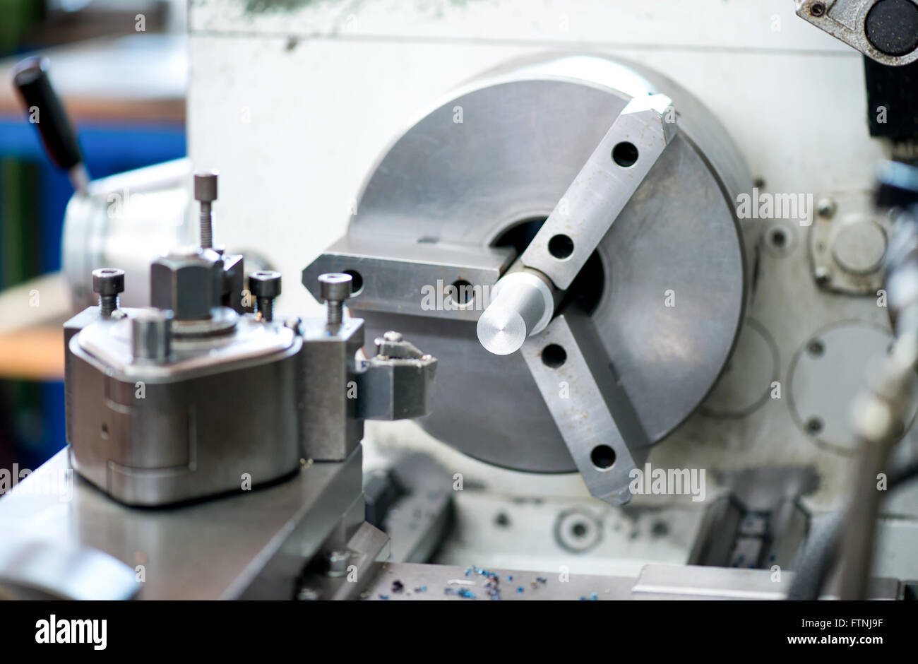 Close up detail of an industrial lathe in a factory or workshop used in engineering for the production of component parts Stock Photo