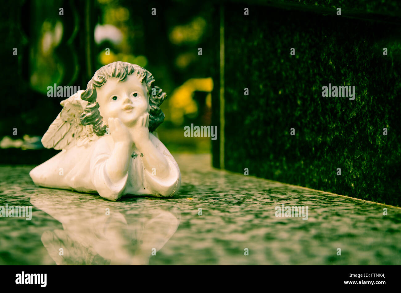 white angel lying on the grave Stock Photo Alamy