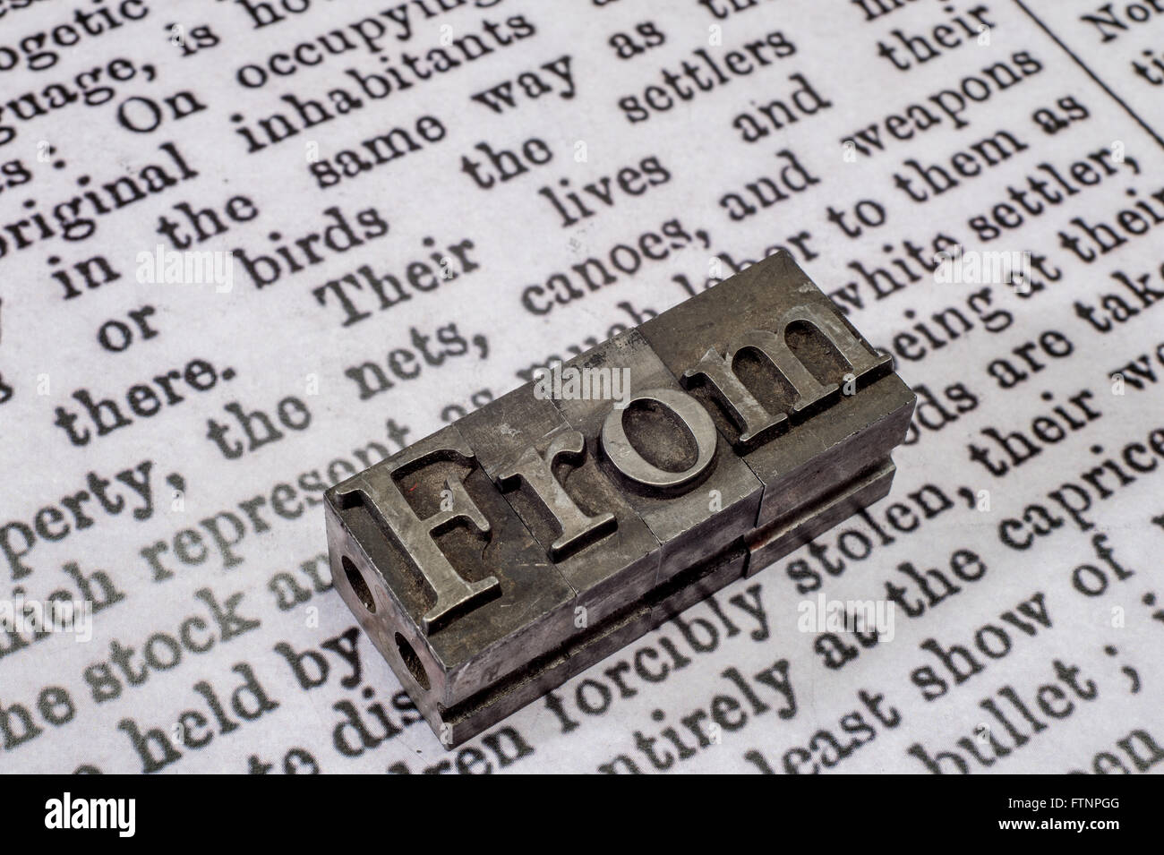 Press or newspaper style blocking letters arranged to display the word From. Stock Photo