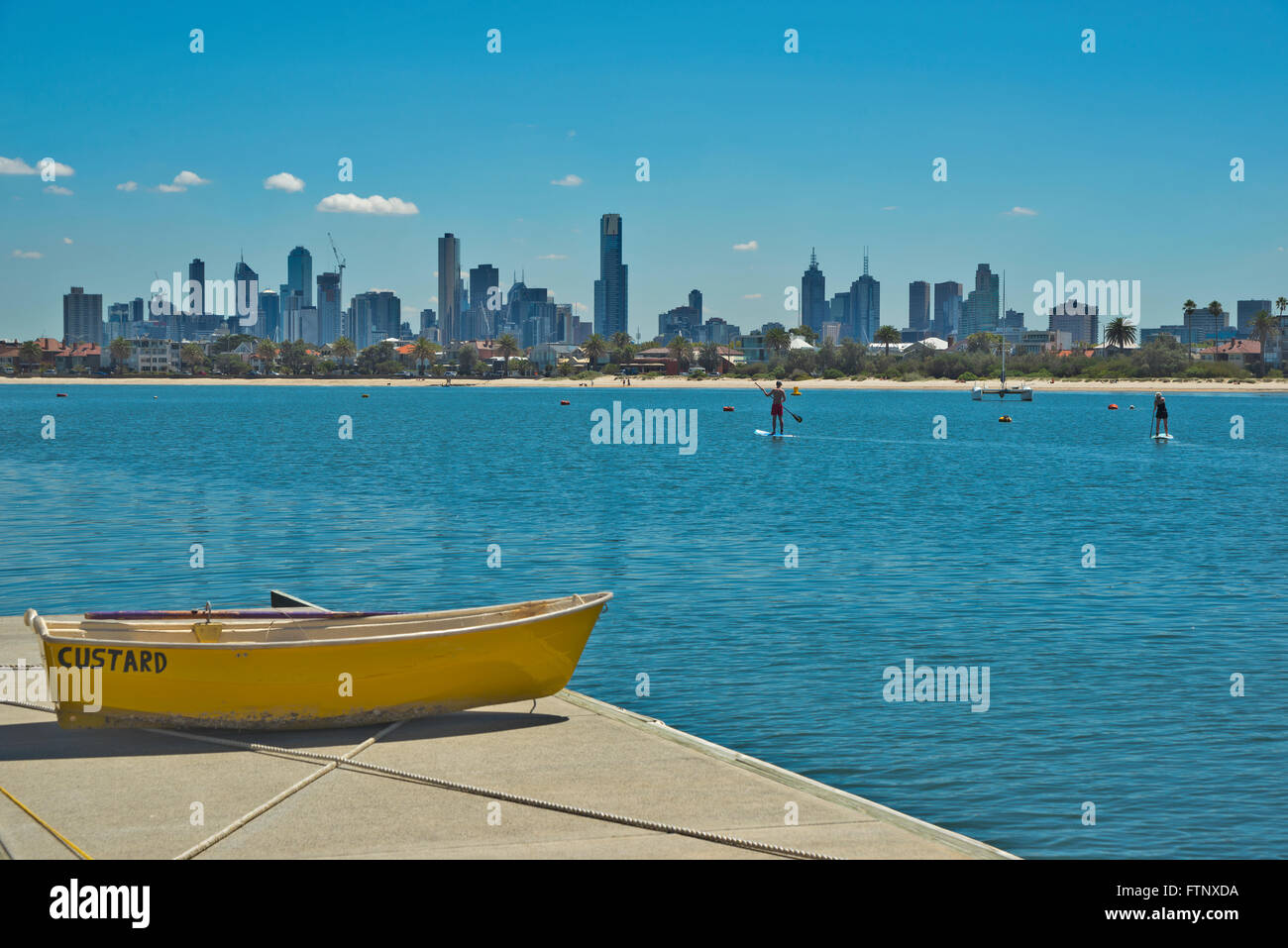 Paddleboarding at St Kilda, Melbourne cityscape in the background.Victoria Australia Stock Photo