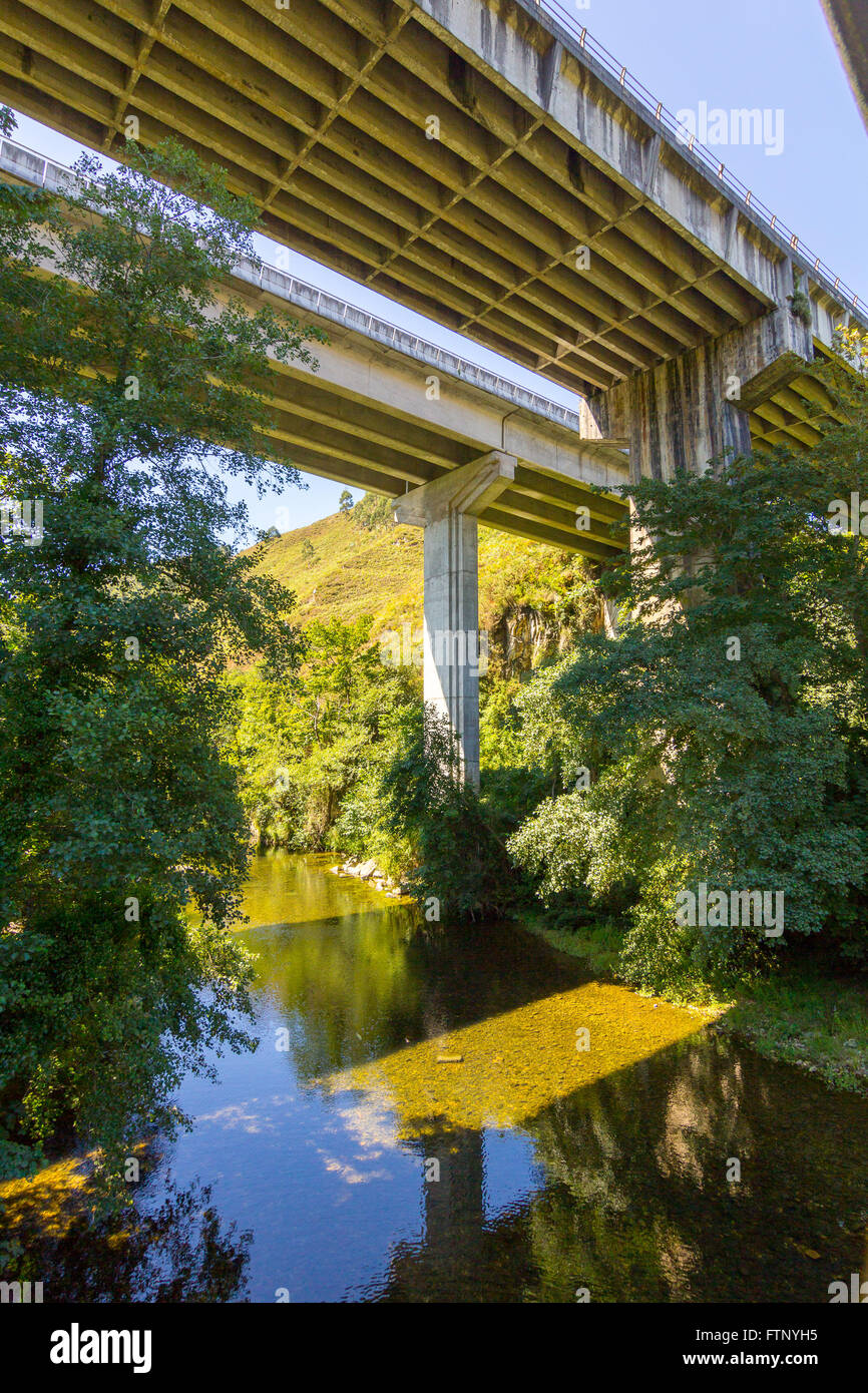 Modern highway bridge over a river Stock Photo