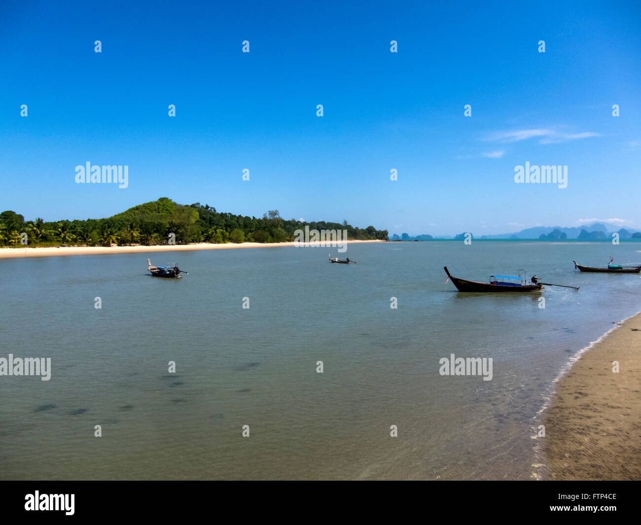 Koh Yao Yai island Thailand, Beach scene and Andaman sea. Long tailed boats moored of shore. Stock Photo