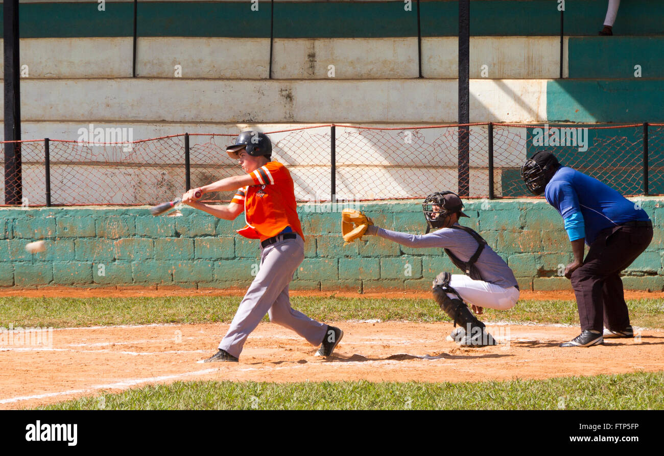 Young people playing baseball on the local field in Vinales, Cuba. Stock Photo
