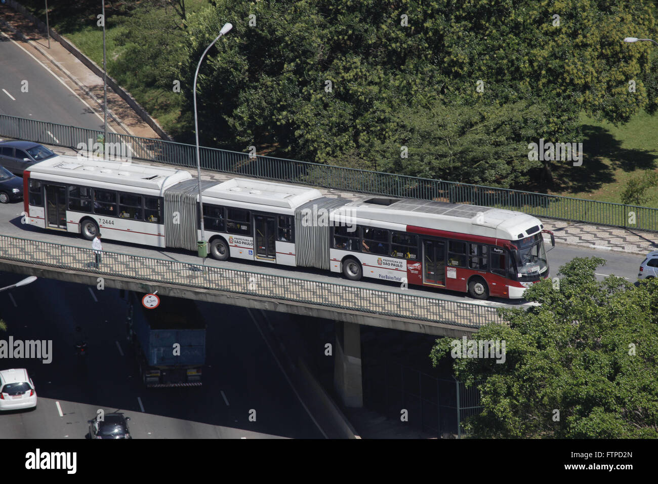 biarticulated buses traveling on Avenue overpass on May Twenty Three