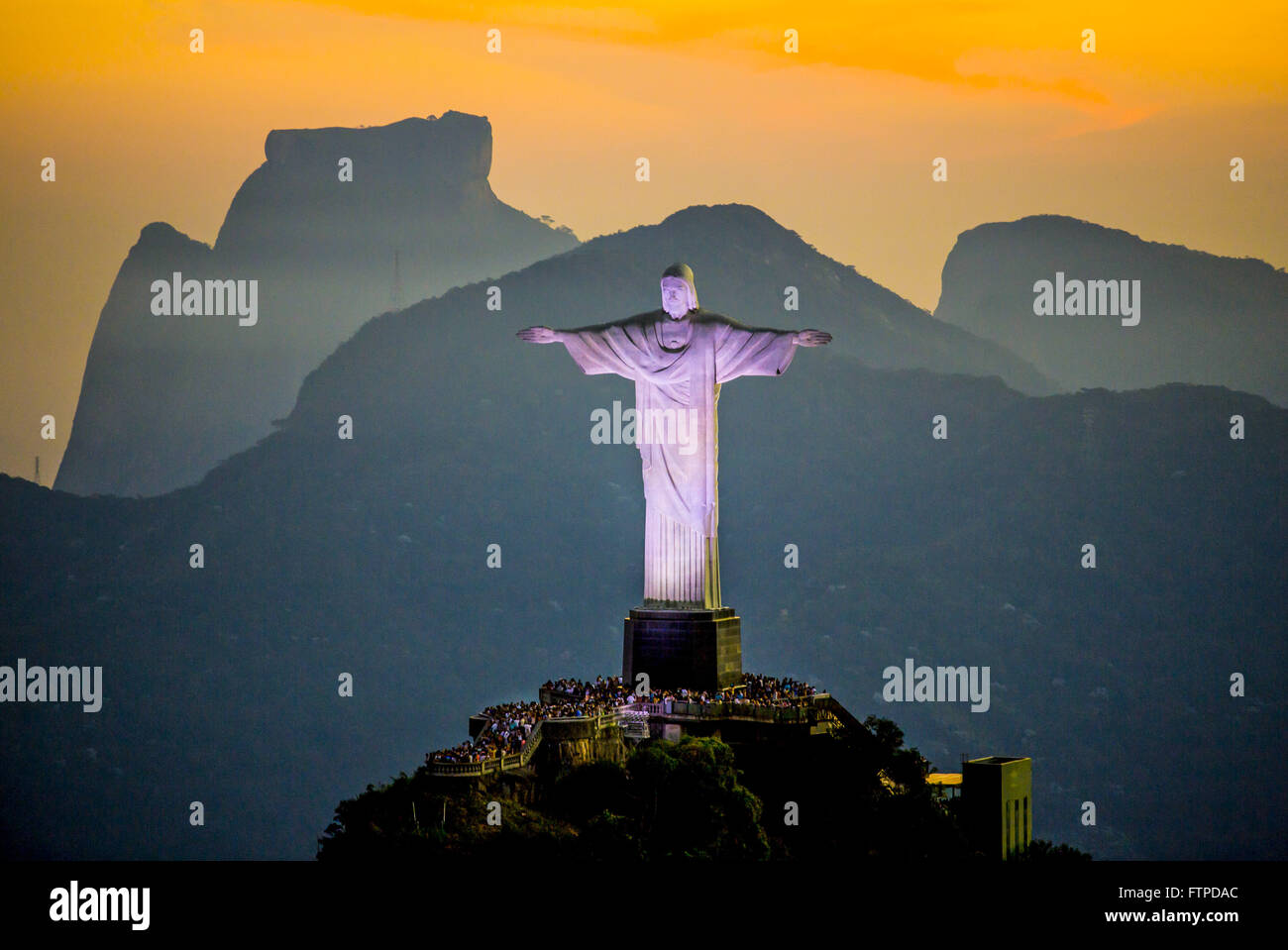 Sunsets in the Christ the Redeemer on Corcovado Mountain with Sugar Loaf in the background Stock Photo