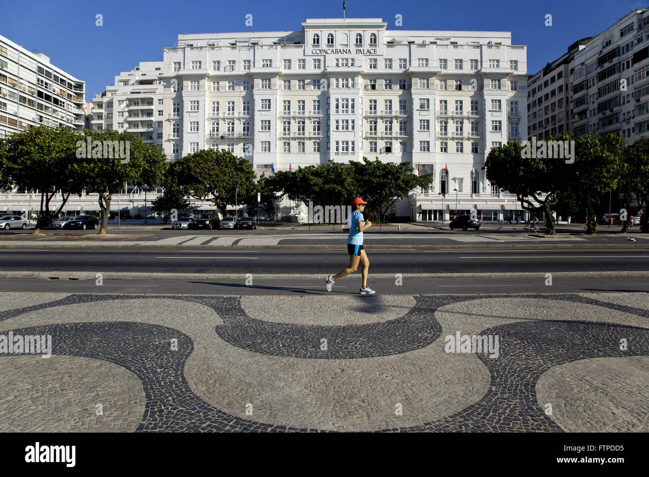 Boardwalk of Copacabana Beach and Copacabana Palace Hotel in Atlantica Avenue Stock Photo