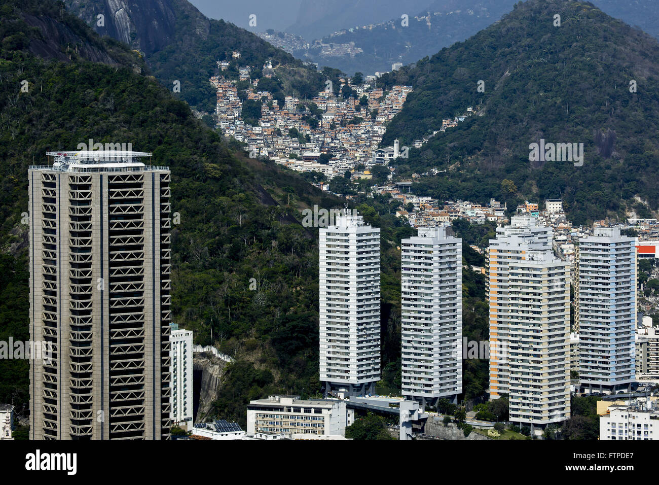 Residential condominium in the Botafogo neighborhood with slum Slope Tabajaras Incidental Stock Photo