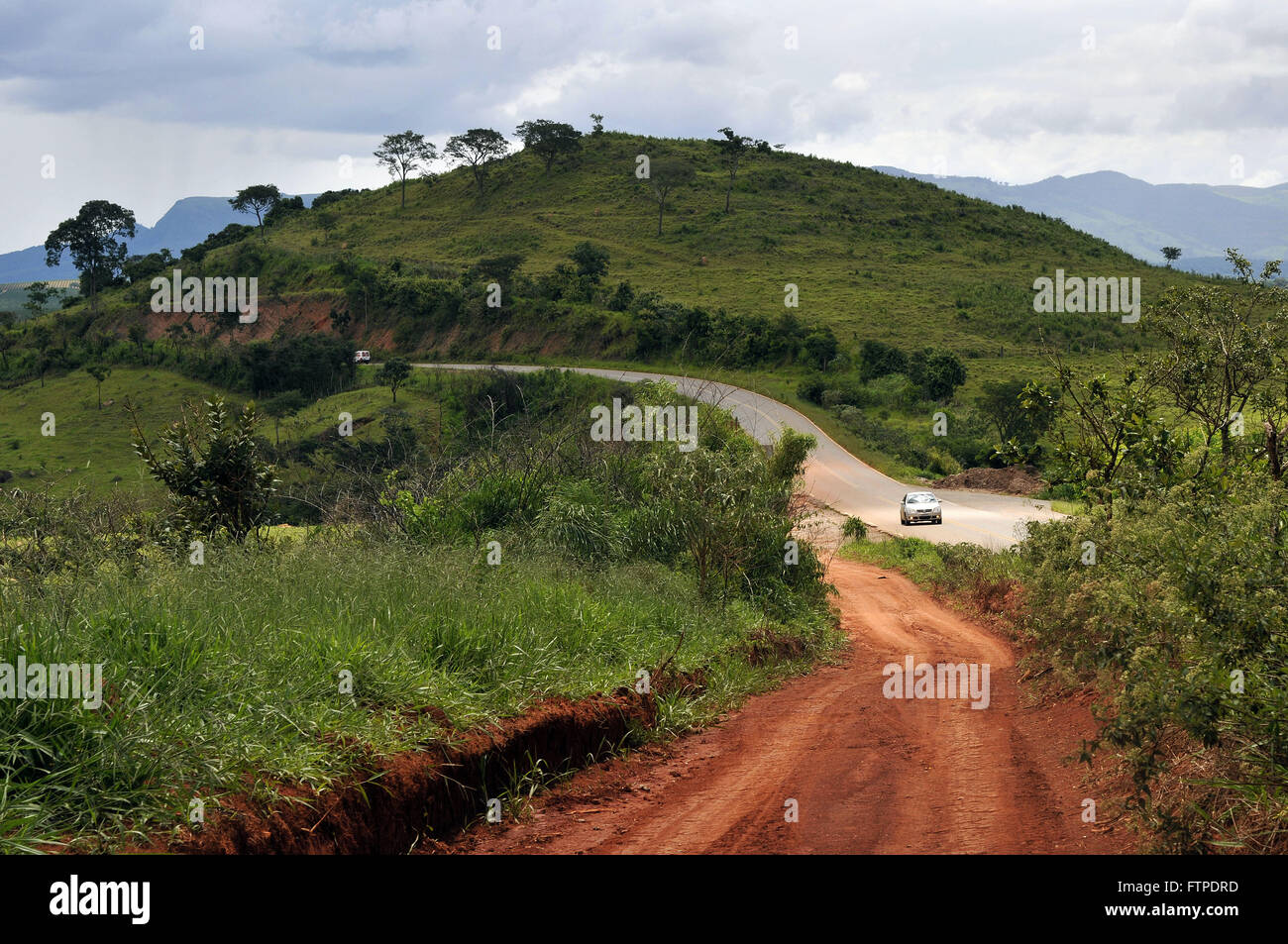 Dirt road in rural Aguanil with the MG-369 in the background Stock Photo