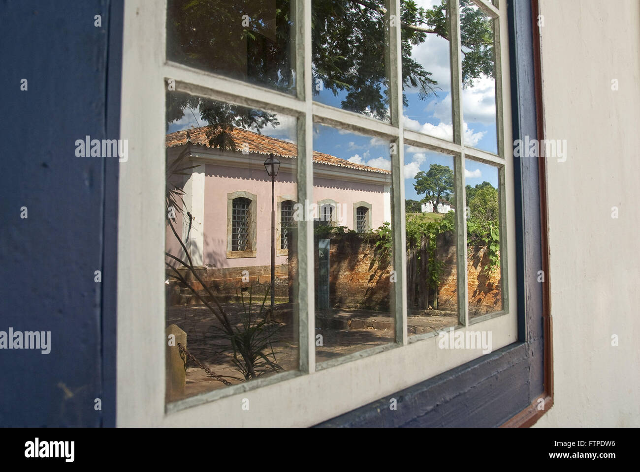 Reflection chain publishes in the eighteenth century colonial window Stock Photo