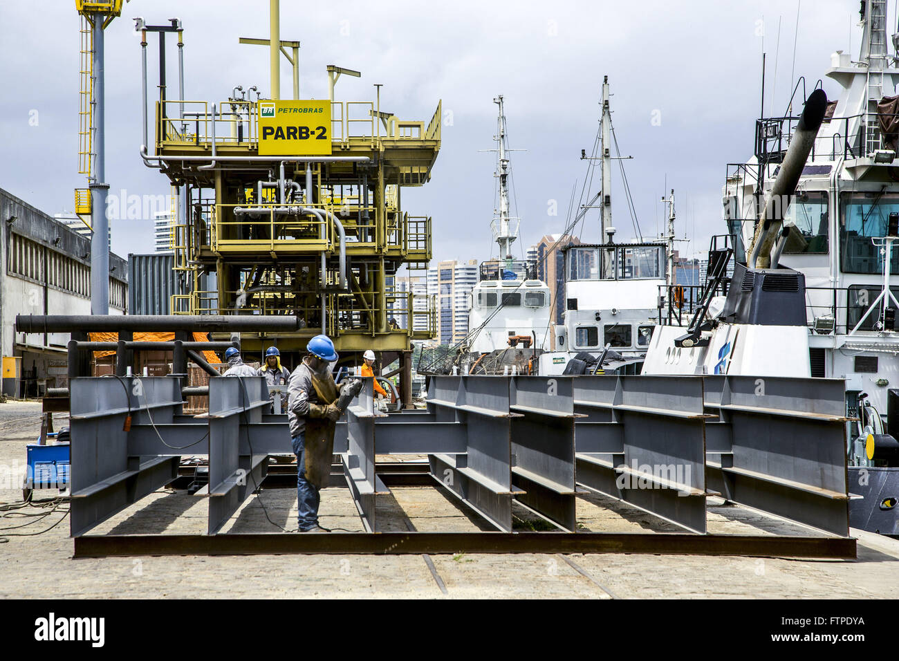 Workers in oil pier in port Stock Photo