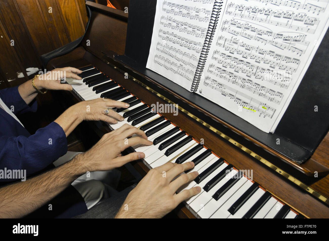 Musicians playing piano four hands in Dramatic and Musical Conservatory Dr.  Carlos de Campos Stock Photo - Alamy