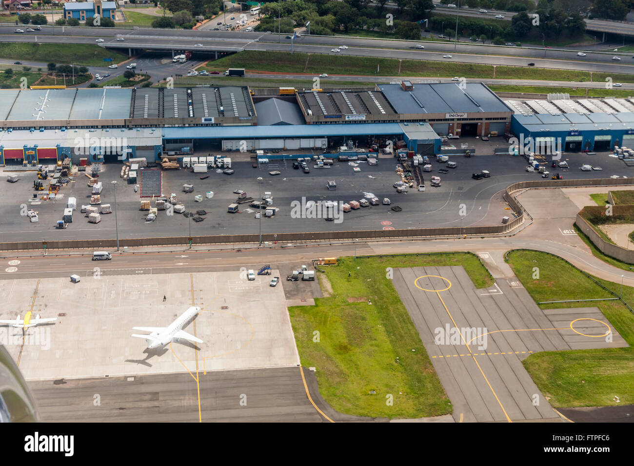 Elevated view of part of the cargo terminal of OR Tambo International Airport, Johannesburg, South Africa. Palettes of cargo. Stock Photo