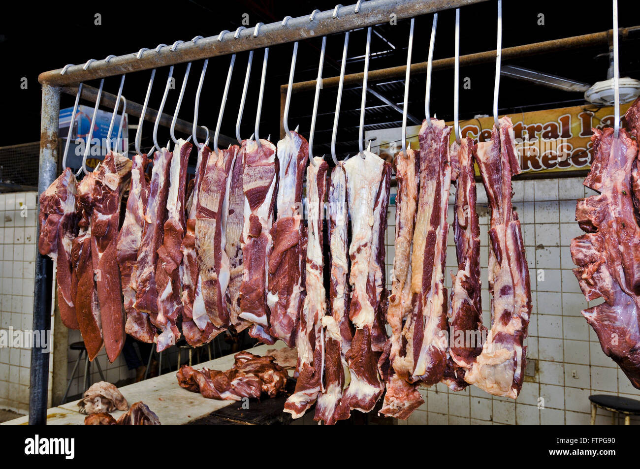 Meat hanging sale at City Market the rough region Stock Photo Alamy
