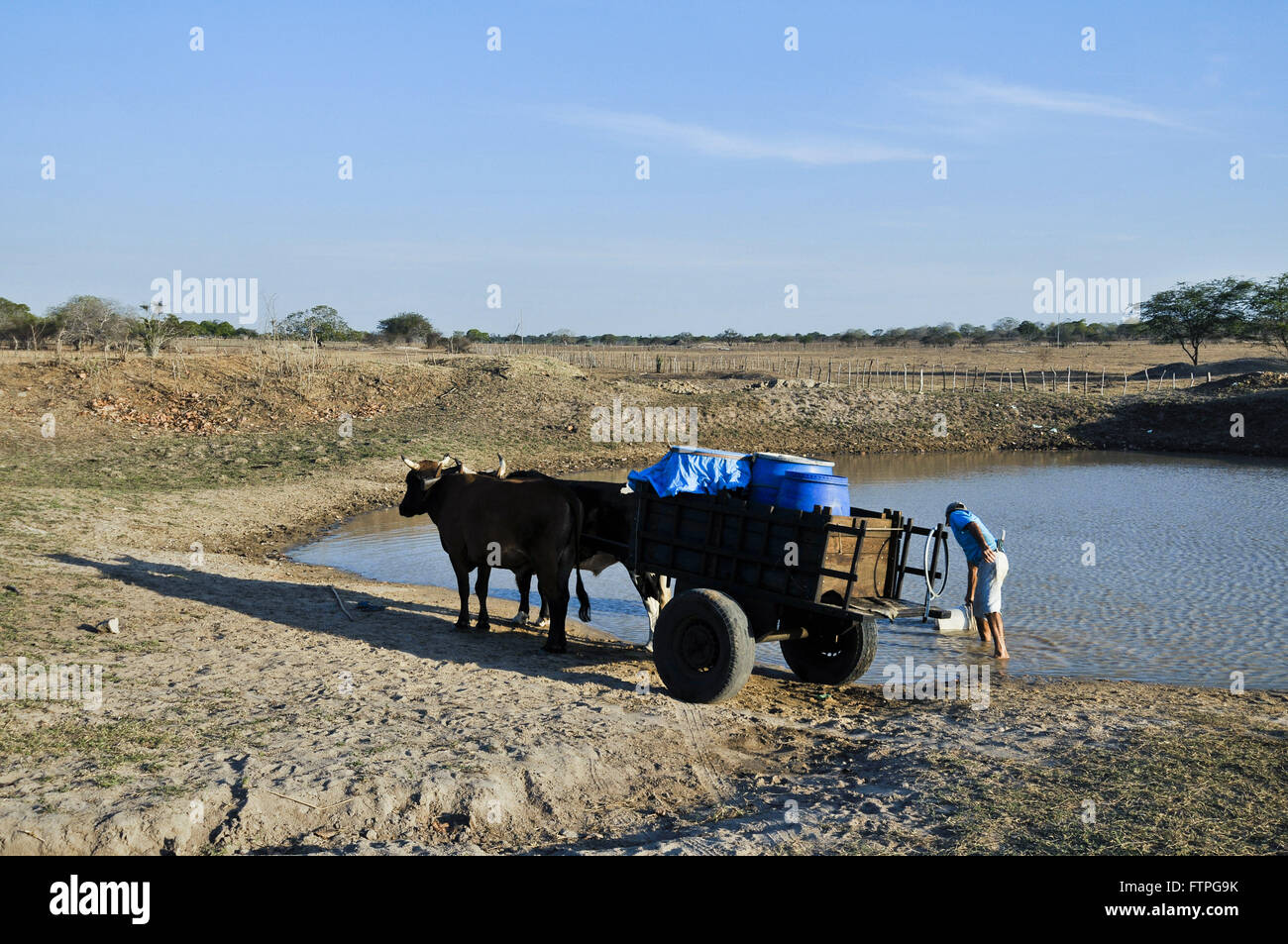 Farmer collecting water weir in the countryside - the rough region Stock Photo