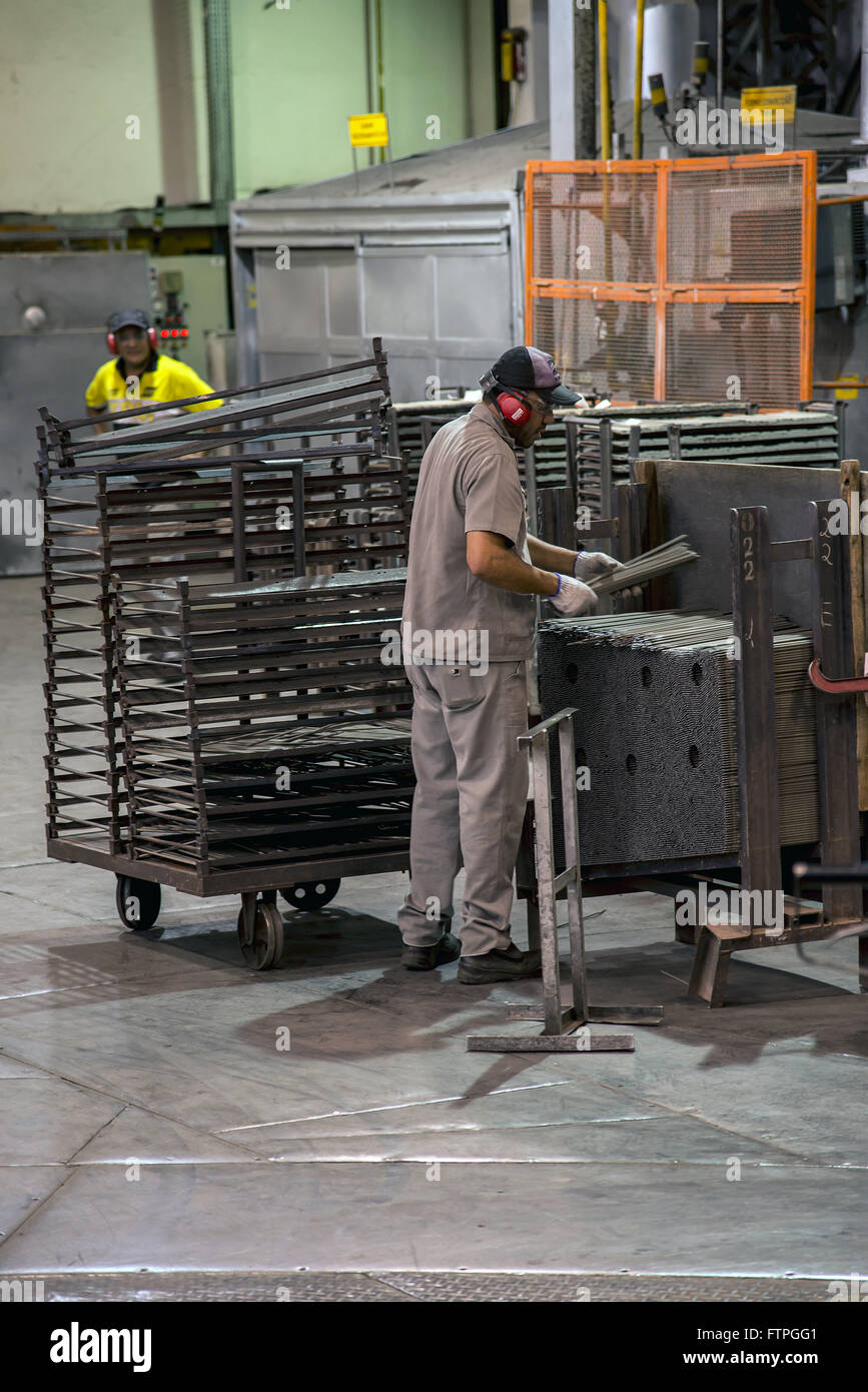 Workmen in manufactures of electrodes used for welding Stock Photo